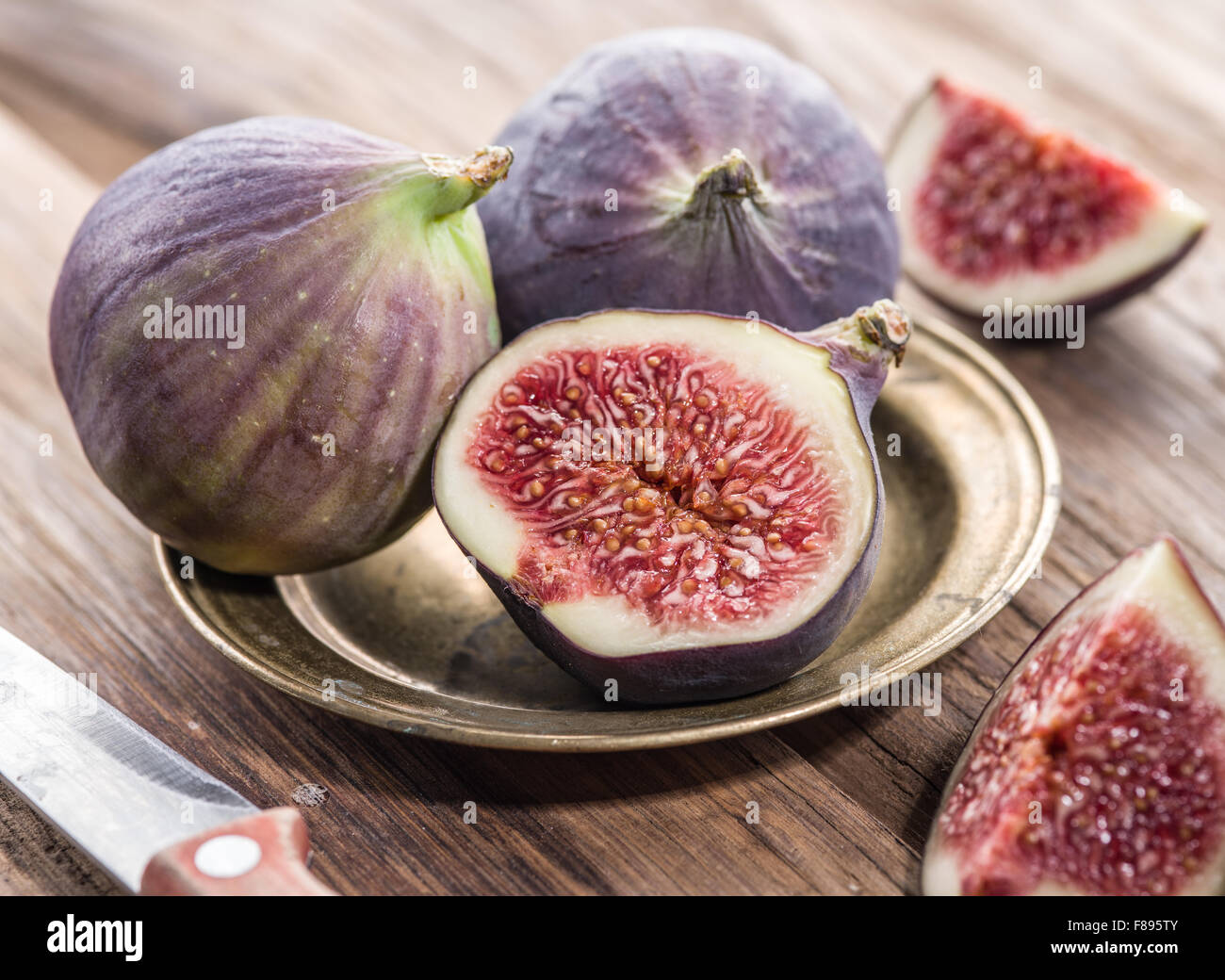 Ripe fig fruits on the wooden table. Stock Photo