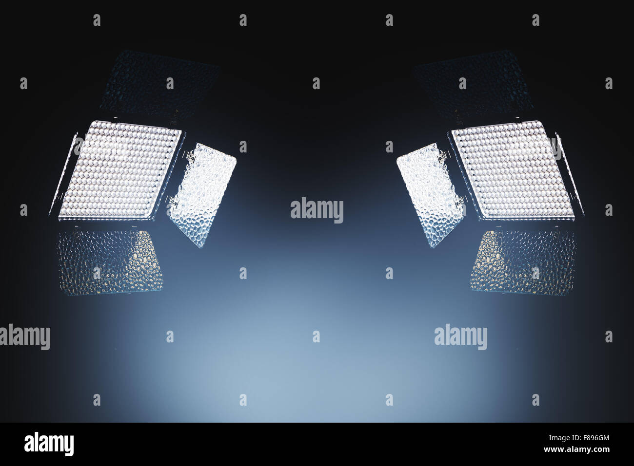 Professional LED lighting equipment for photo and video production in dark studio interior Stock Photo