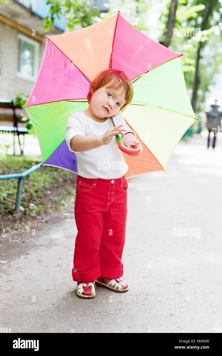 Twoyear baby girl with umbrella in summer Stock Photo Alamy
