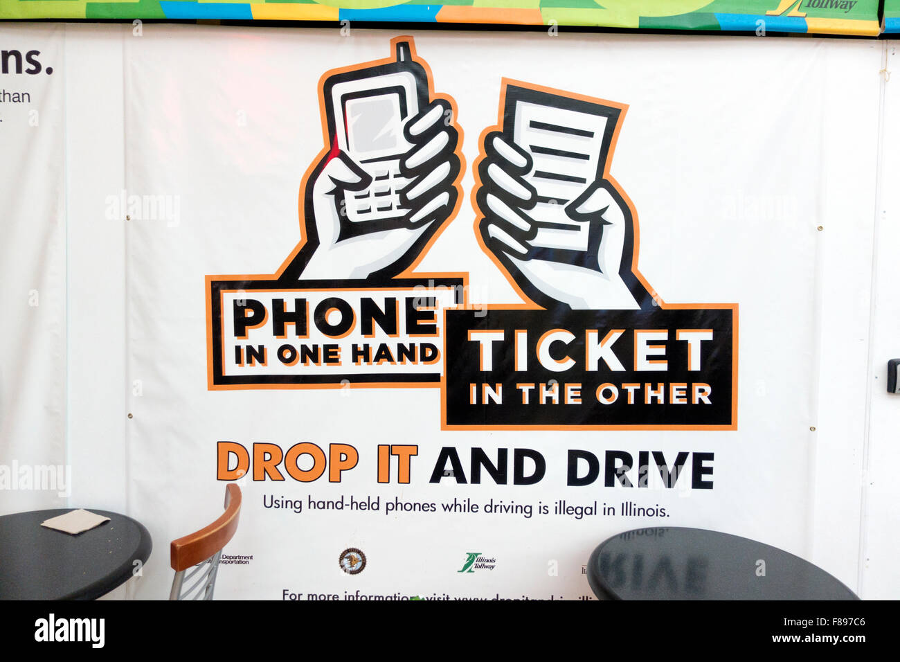 Warning poster ticket issued for driving with phone in hand at