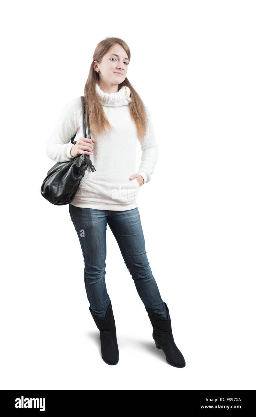 Isolated full length view of Long-haired teen girl in sweater with bag over white Stock Photo