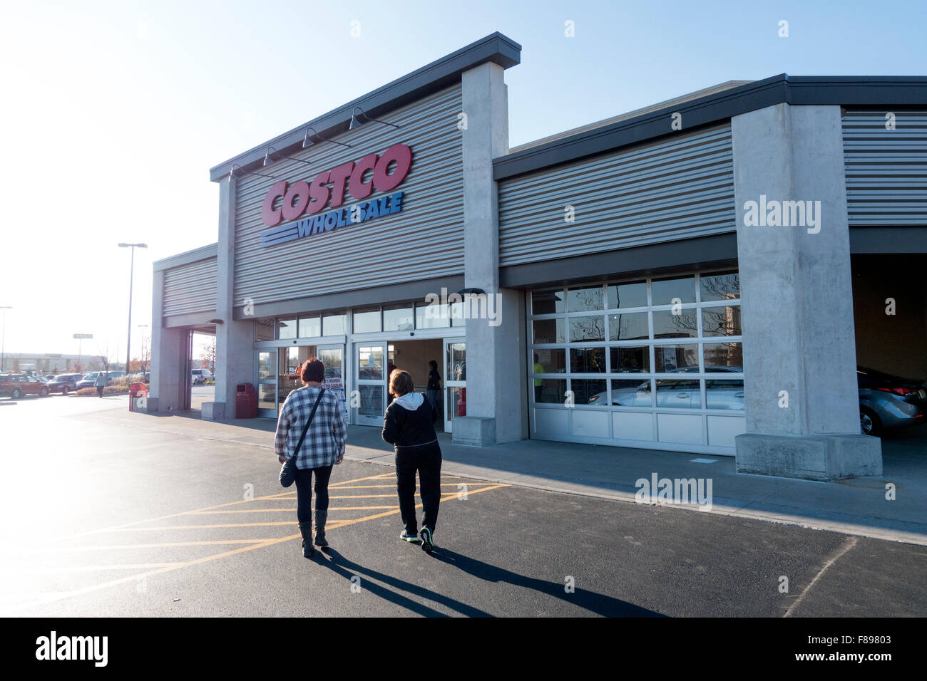 Customers crossing Costco Wholesale parking lot to enter store. Bolingbrook Illinois IL USA Stock Photo