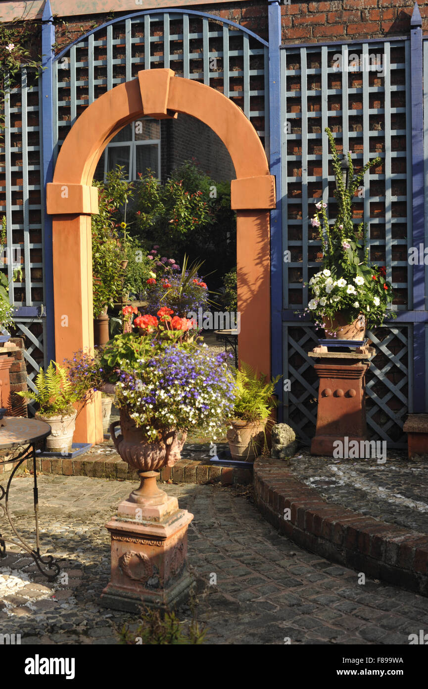 Back garden with trellis and mirror Stock Photo Alamy