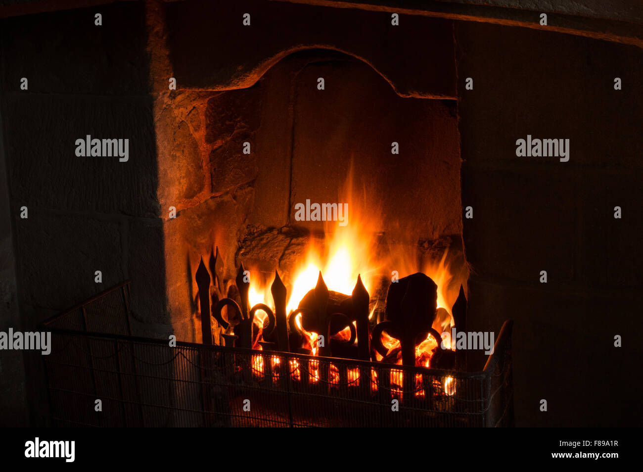Orange Flames In A British Coal Fireplace In Winter Stock Photo