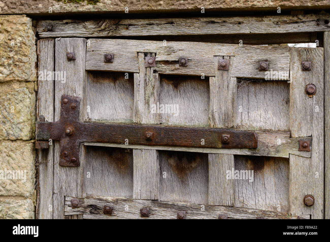 Detail of hinges on a weathered, old door Stock Photo