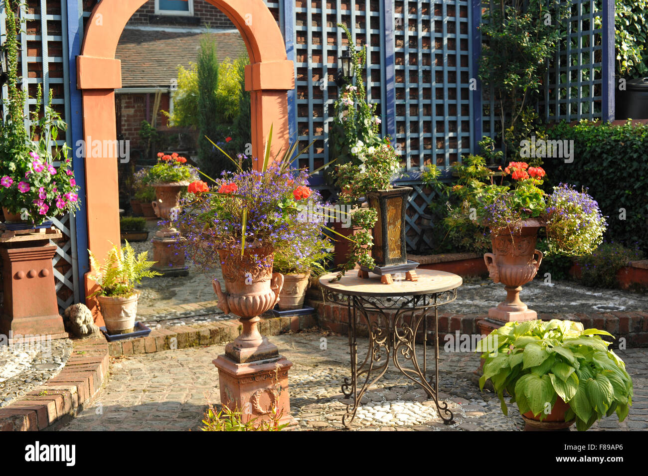 Back garden with trellis and mirror Stock Photo Alamy