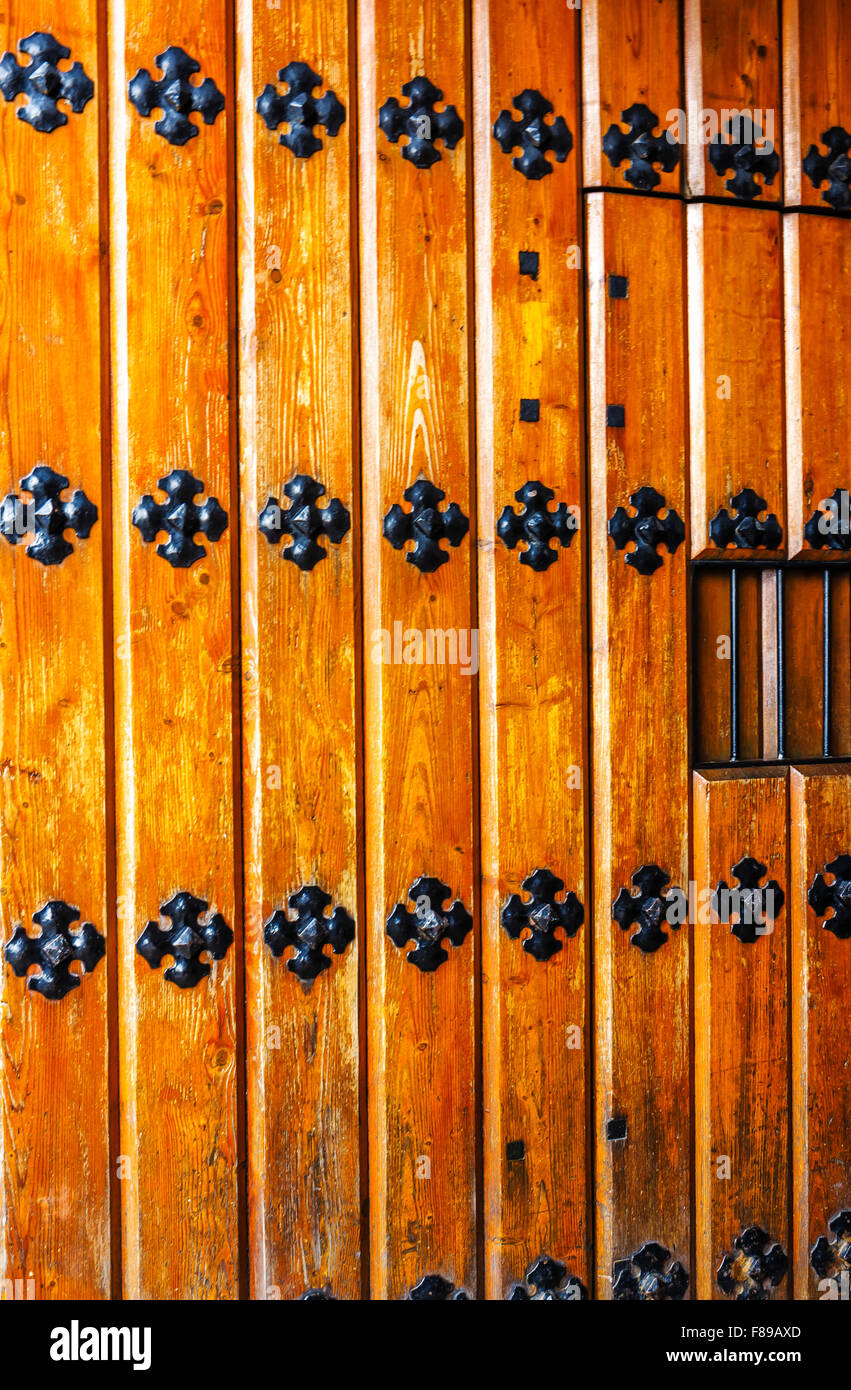 Ancient wooden door with iron fittings Stock Photo