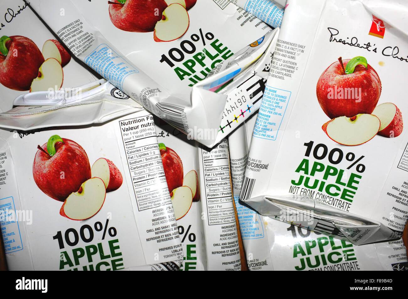 A pile of used apple juice cartons. Stock Photo