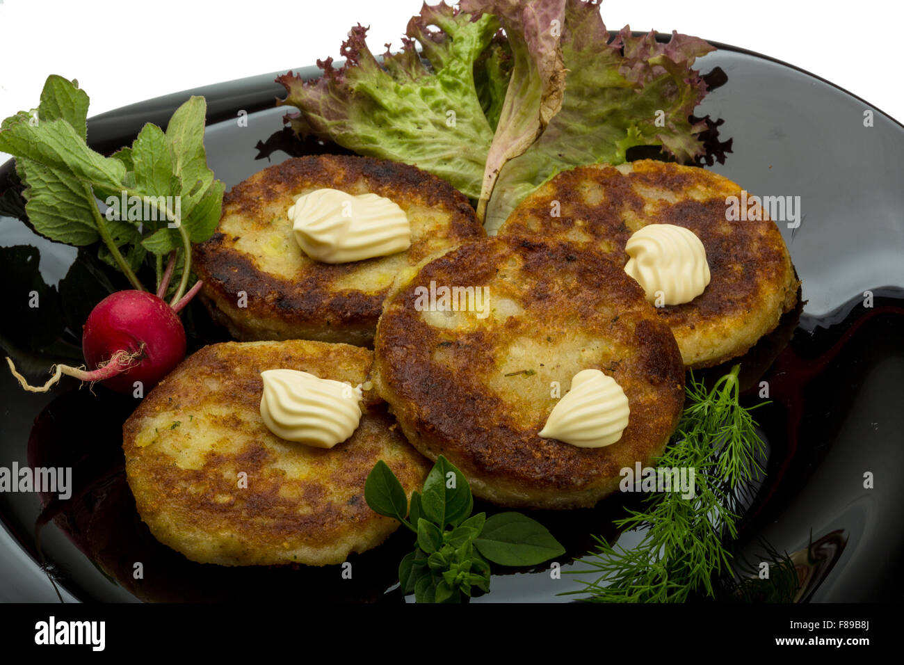 Hash browns with herbs on the plate Stock Photo Alamy