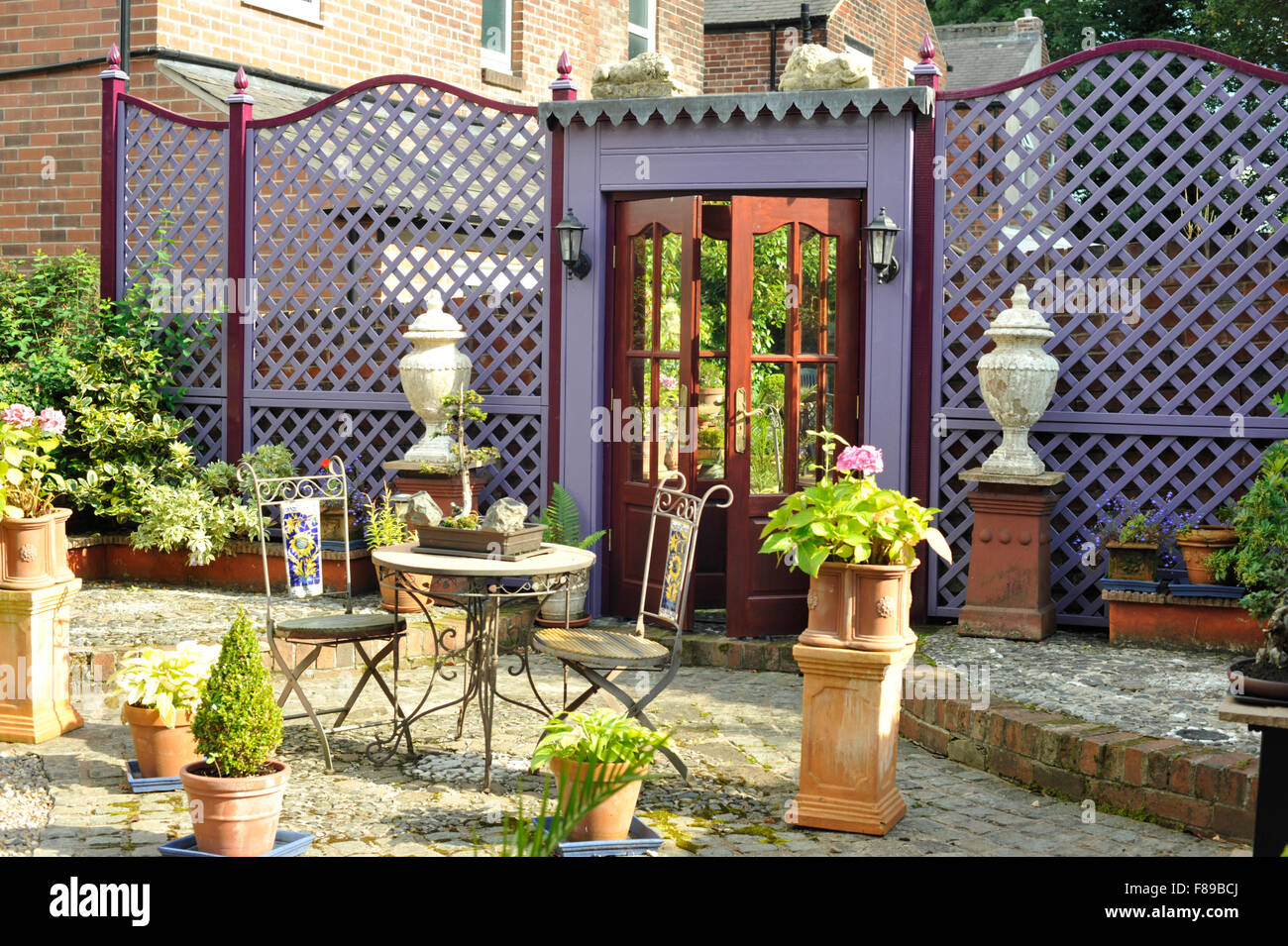Trellis and fake doorway with mirror in Garden Stock Photo Alamy