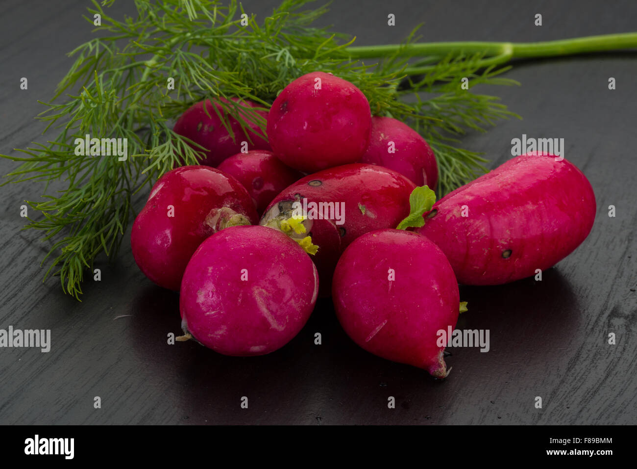 Radish with dill on the desk Stock Photo - Alamy