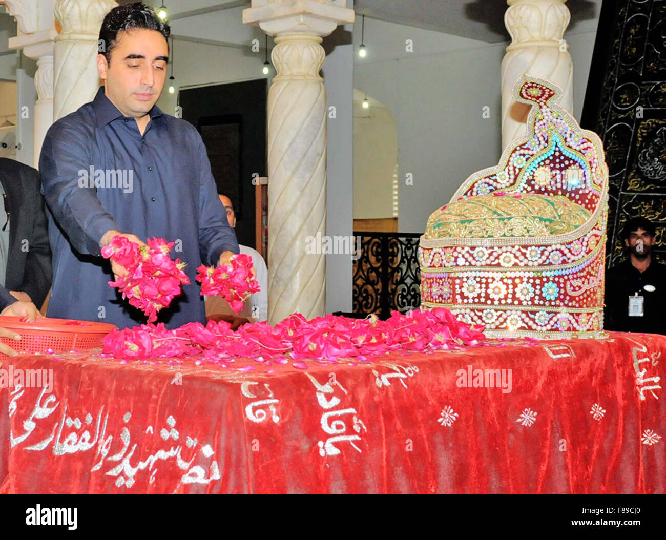 Chairman People Party (PPP) Bilawal Bhtto Zardari flowering on grave of founder People Party Zulfiqar Ali Bhutto, in Garhi Khuda Bux on Monday, December 07, 2015. Stock Photo