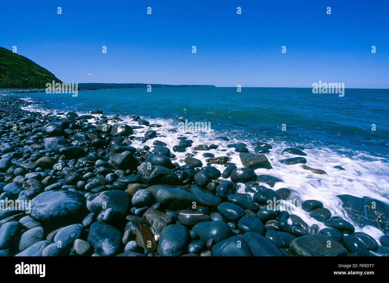 Greencliff Beach View at High Tide, Looking South West towards Bucks Mills, Devon, UK. (Velvia scan) Stock Photo