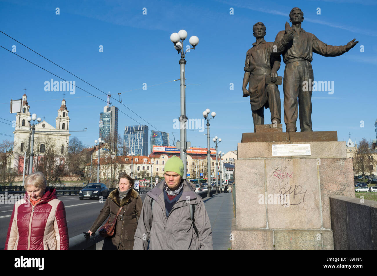Vilnius, Lithuania. People at the Soviet Green Bridge. Industry and construction sculptures by Bronius Vyšniauskas and Napoleonas Petrulis Stock Photo