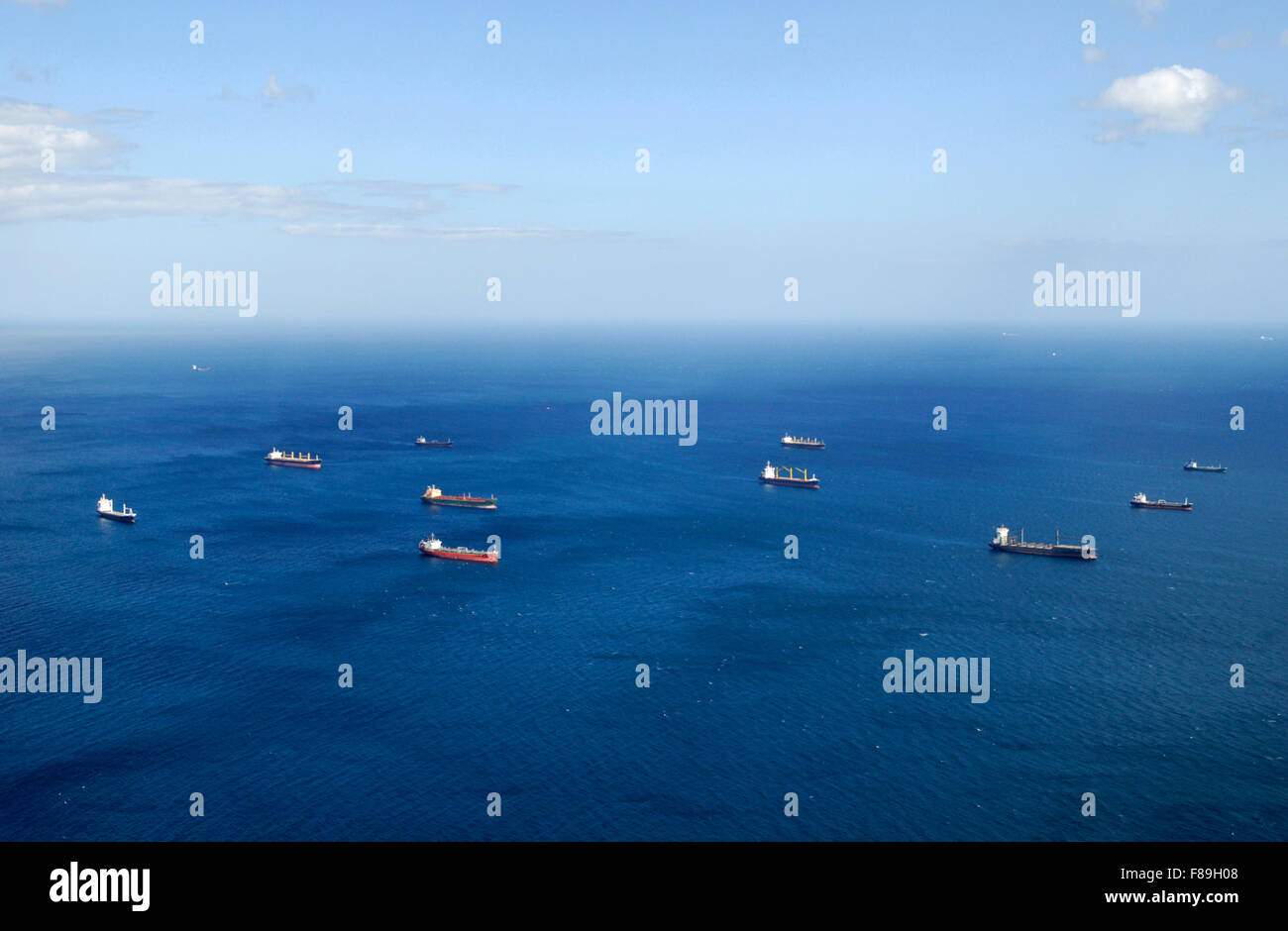 Shipping anchored in the Mediterranean, east of Gibraltar, idling due to the economic turndown.  September 2012. Stock Photo