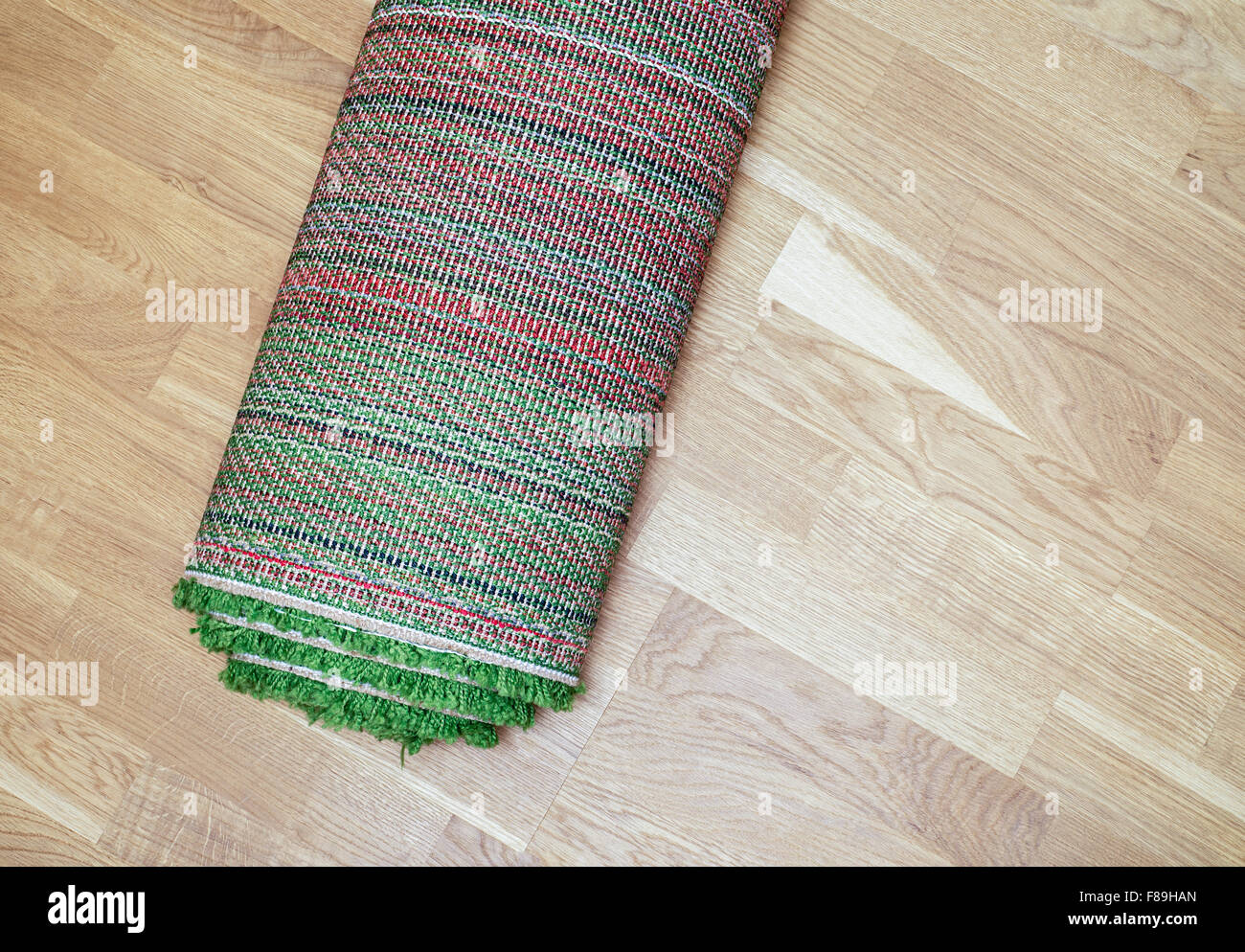 rolled carpet on the floor Stock Photo Alamy