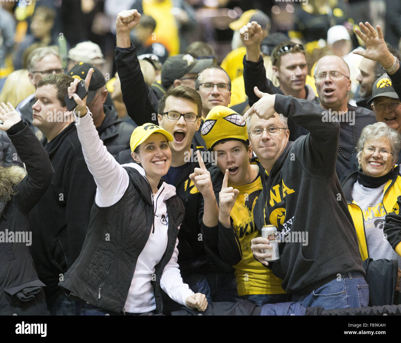Indianapolis, Iowa, USA. 5th Dec, 2015. Fans cheer and wave to the