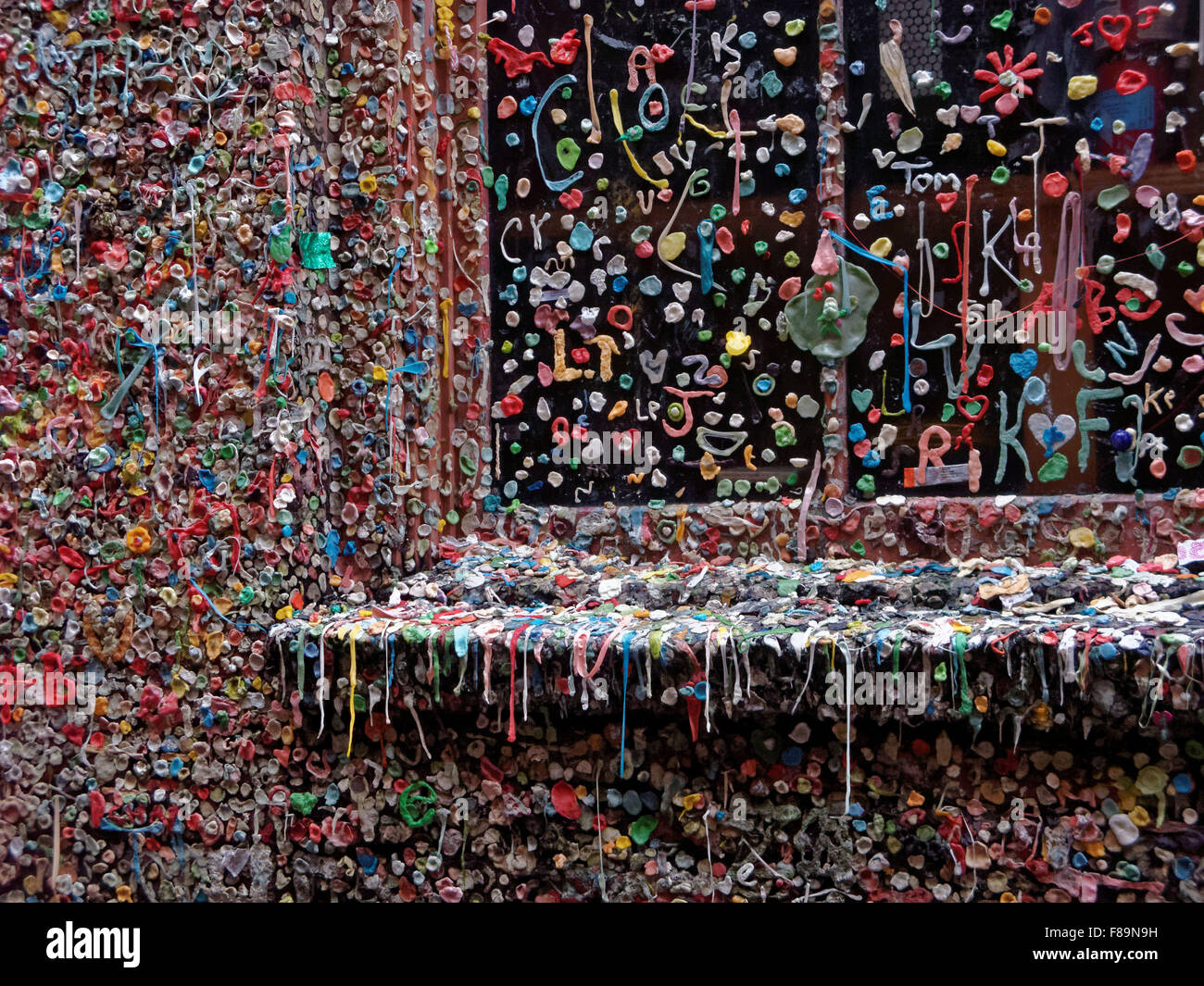 The Pike Place Market Theater Gum Wall in Seattle, Washington is covered in used chewing gum,. Stock Photo