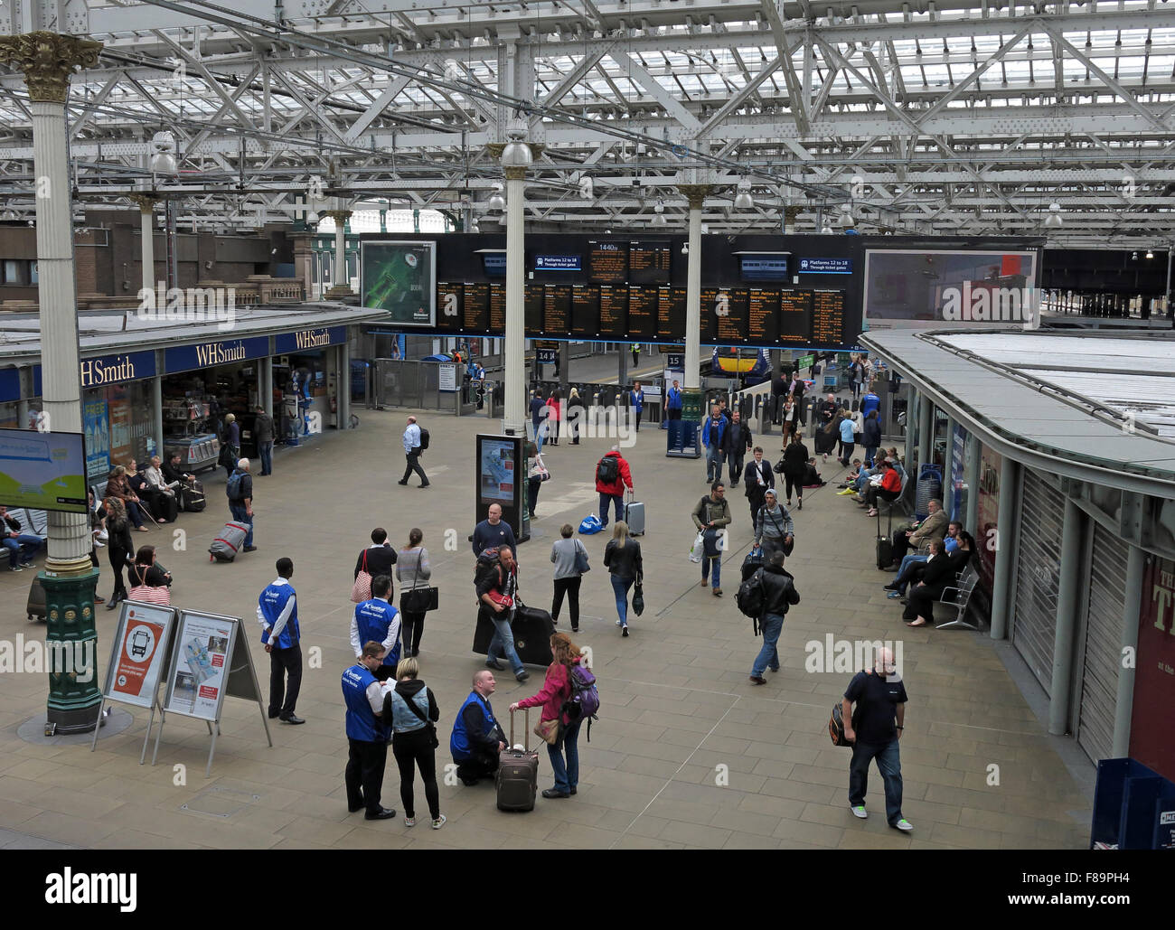 Waverley Railway Station, Edinburgh, Scotland with passengers near departure boards Stock Photo