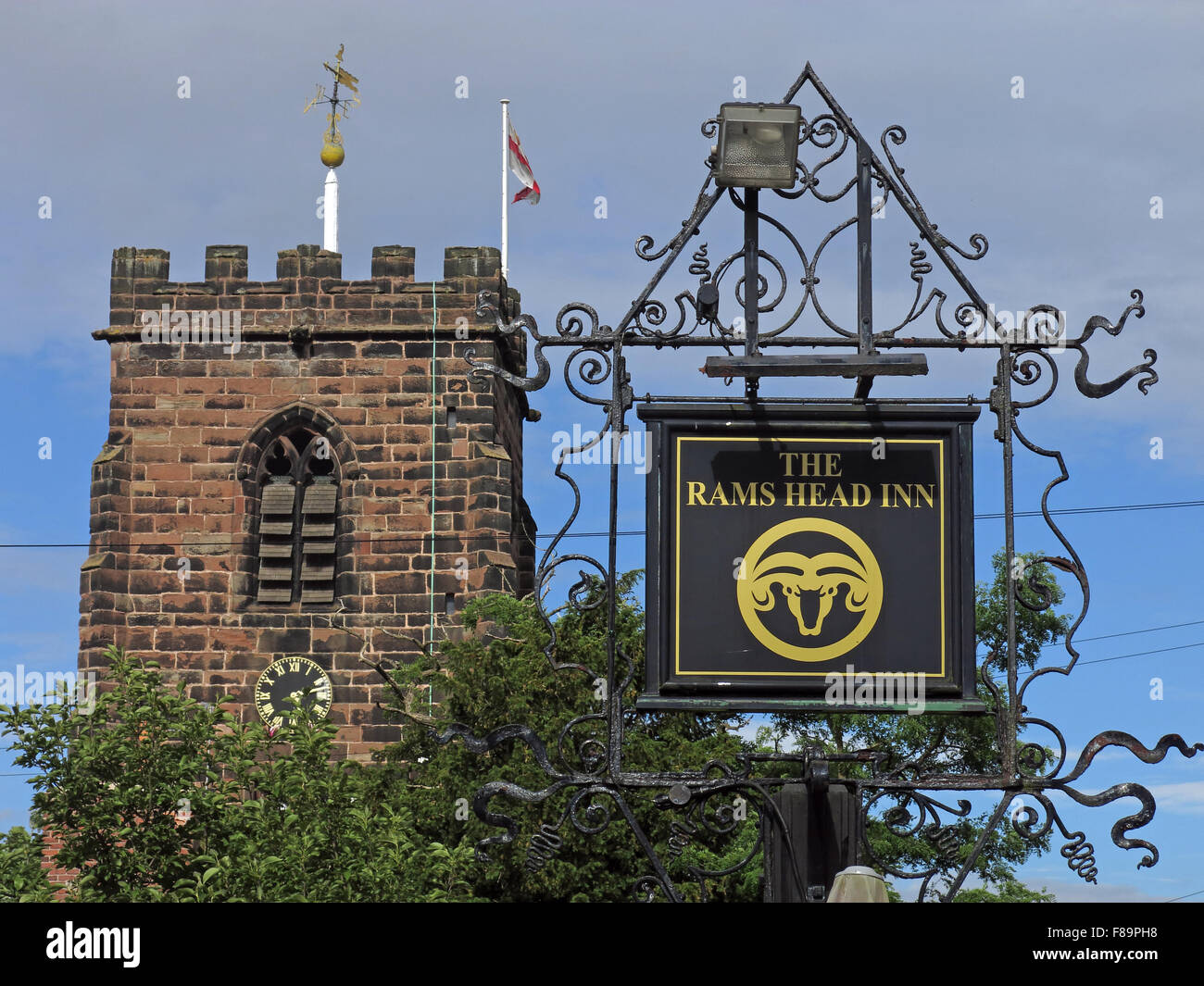 Rams Head inn sign & St Wilfrids Church tower ,Grappenhall, Warrington, Cheshire, England, UK, WA4 2SG Stock Photo