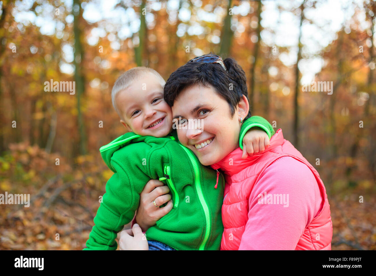 Autumn portrait of cute boy and mother(shallow DOF) Stock Photo
