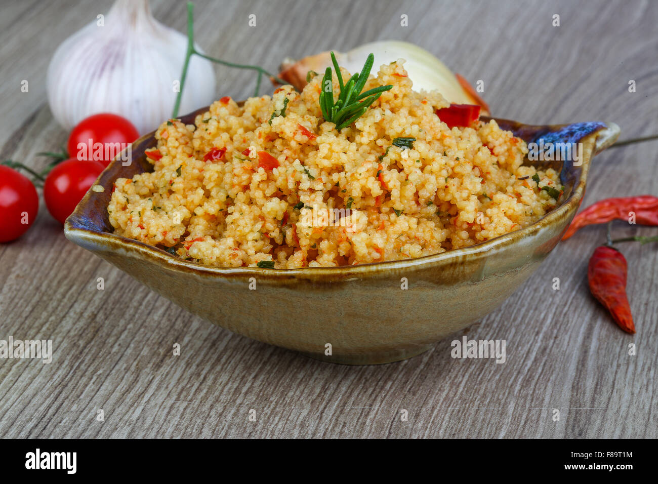 Arabic traditional cuisine Couscous with tomato and green onion Stock