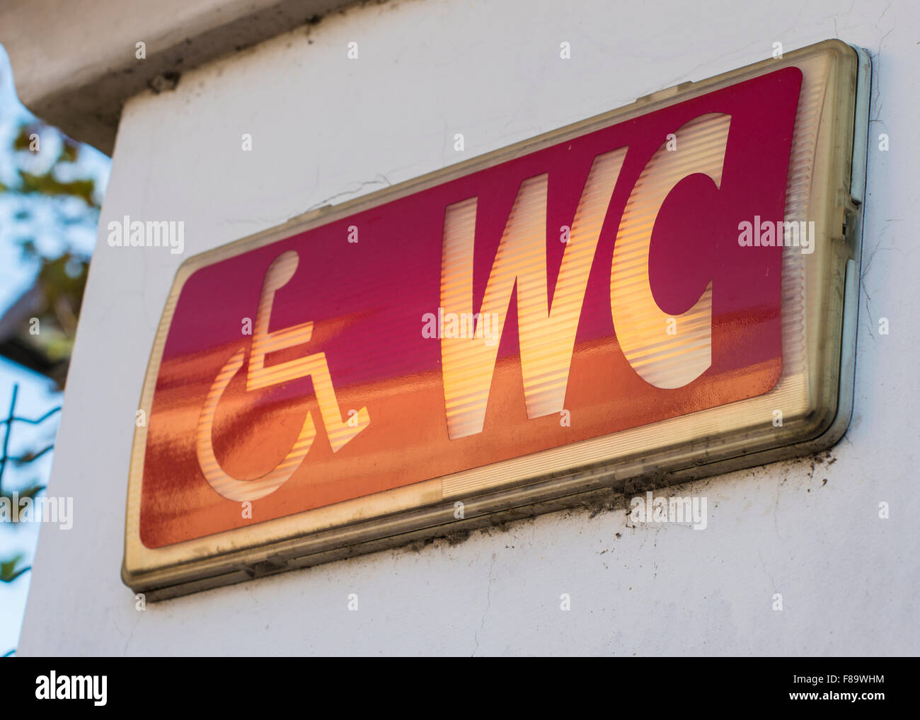 Handicap restroom illuminated sign Stock Photo