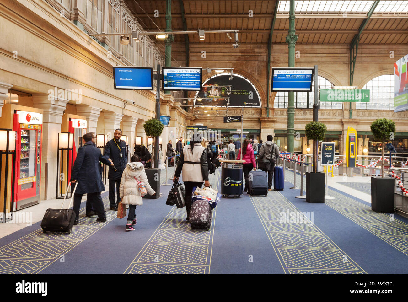 Passengers bound for the UK entering the Eurostar terminal, Gare du Nord station, Paris France Europe Stock Photo