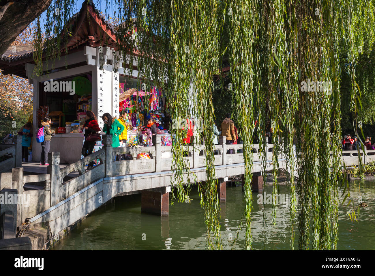 Hangzhou, China - December 5, 2014: Wooden Chinese Gazebo as a souvenir shop on the coast of West Lake, popular park in Hangzhou Stock Photo