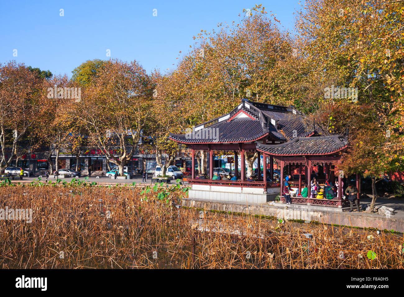 Hangzhou, China - December 5, 2014: Wooden traditional Chinese Gazebo on the coast of West Lake, popular park in Hangzhou city c Stock Photo