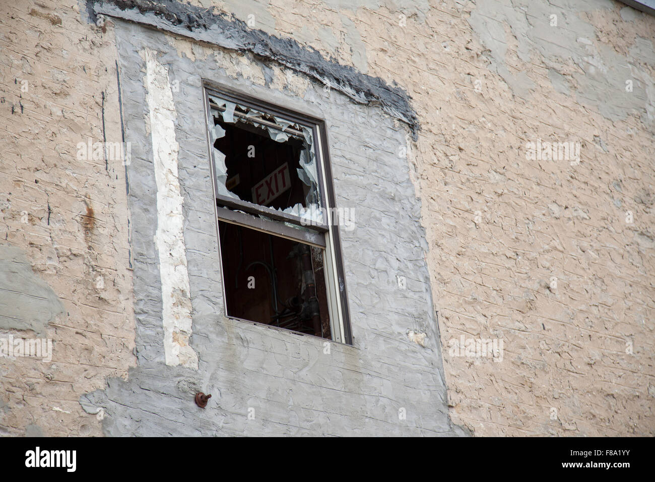 broken window on stone building vandalism Stock Photo - Alamy