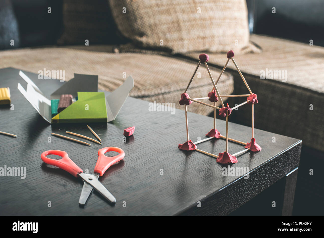 Make house with wooden sticks and plasticine Stock Photo Alamy