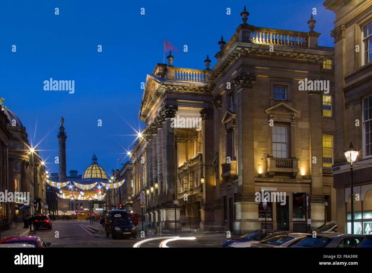 An external view of The Theatre Royal in Newcastle upon Tyne at dusk at Christmas looking towards Grey's Monument Stock Photo