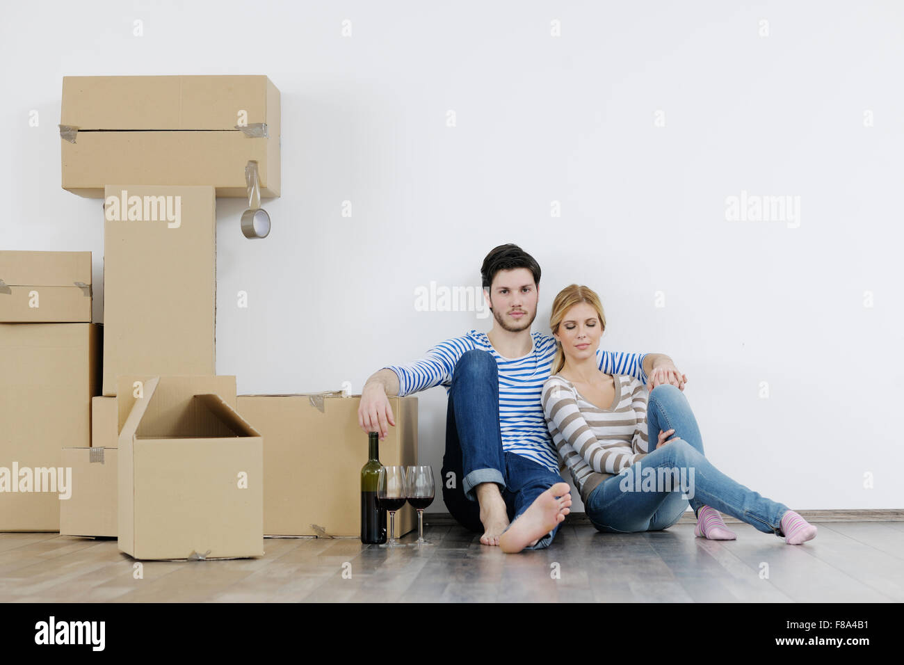 happy Young couple moving in new home Stock Photo - Alamy