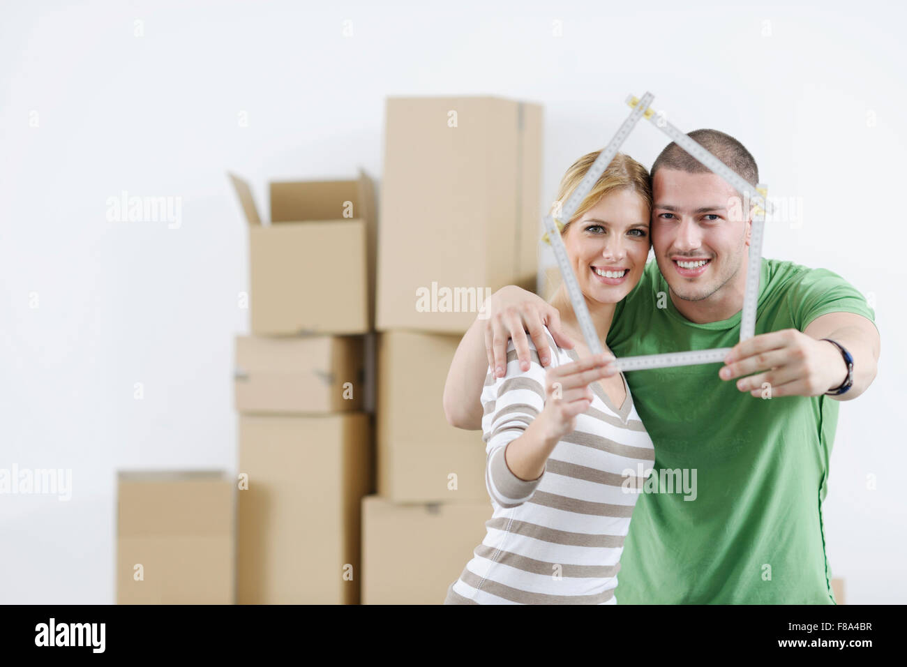 happy Young couple moving in new home Stock Photo - Alamy