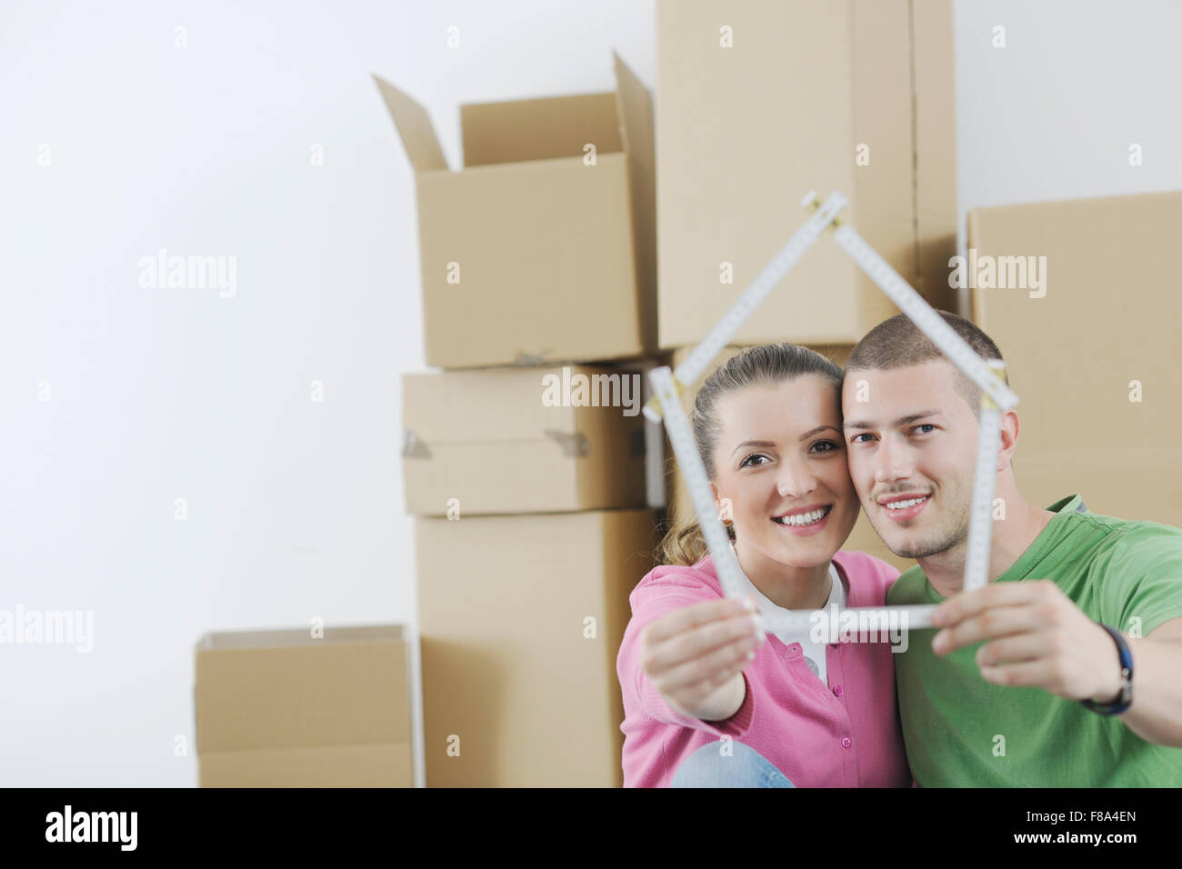happy Young couple moving in new home Stock Photo - Alamy