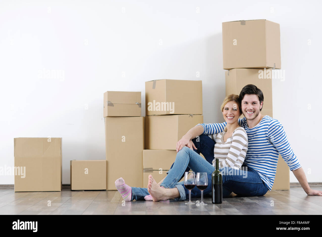 happy Young couple moving in new home Stock Photo - Alamy