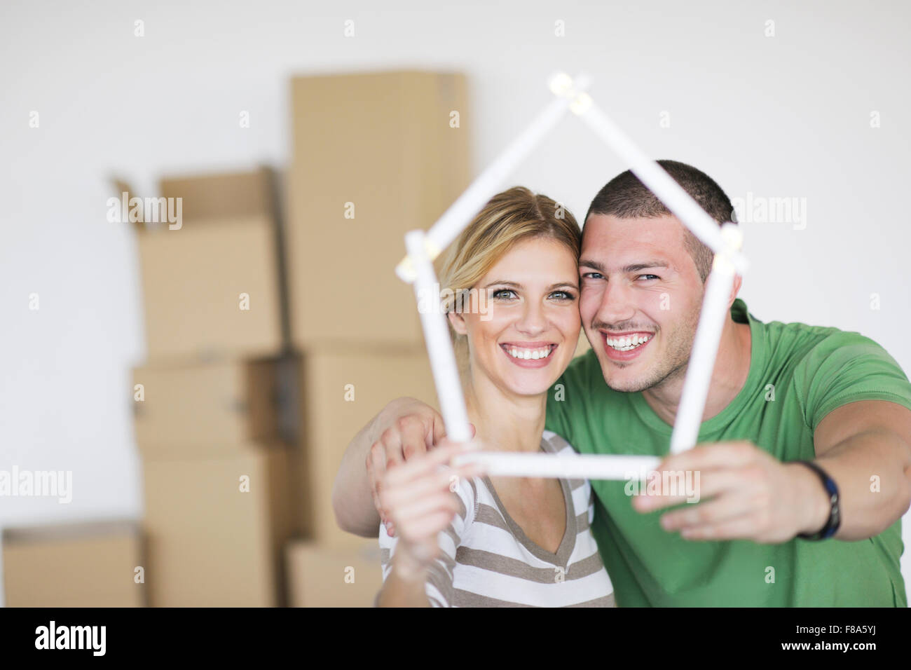 happy Young couple moving in new home Stock Photo - Alamy