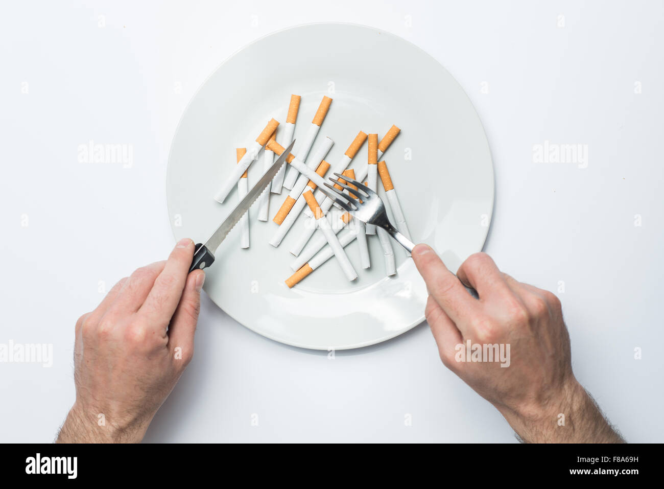 cigarettes on a plate Plate with Cigarettes Stock Photo