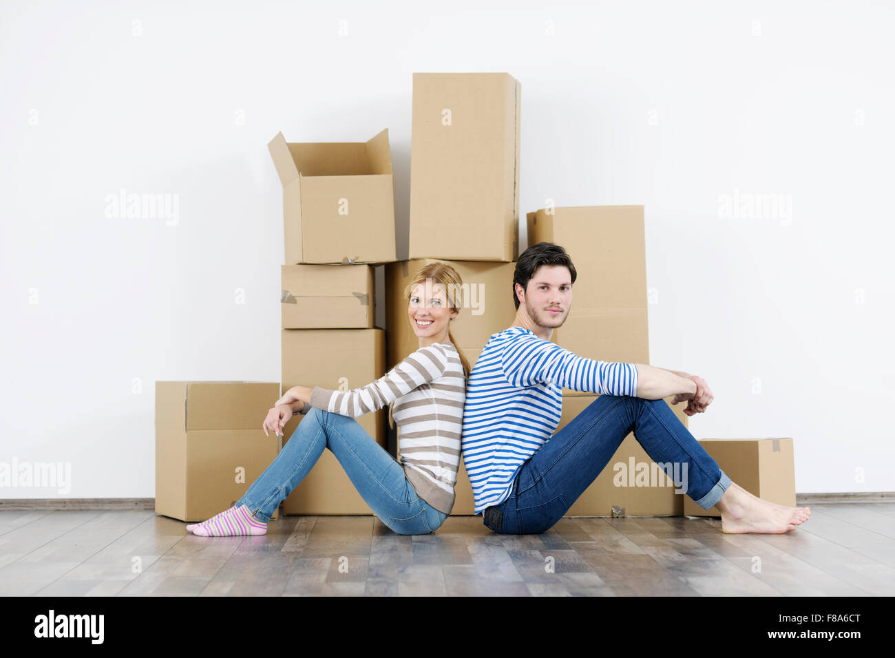 happy Young couple moving in new home Stock Photo - Alamy