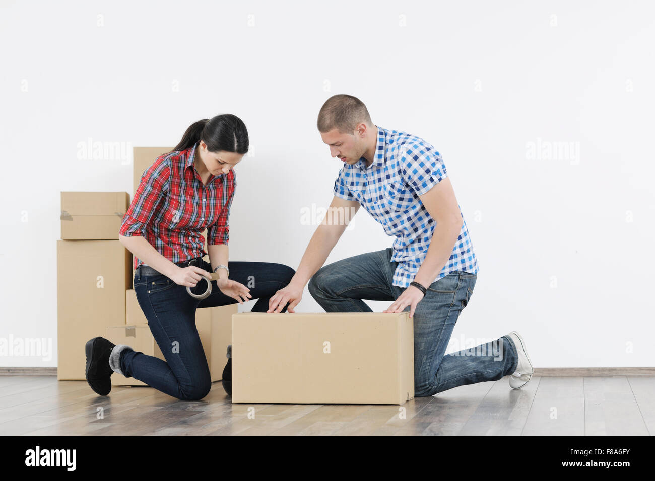 happy Young couple moving in new home Stock Photo - Alamy