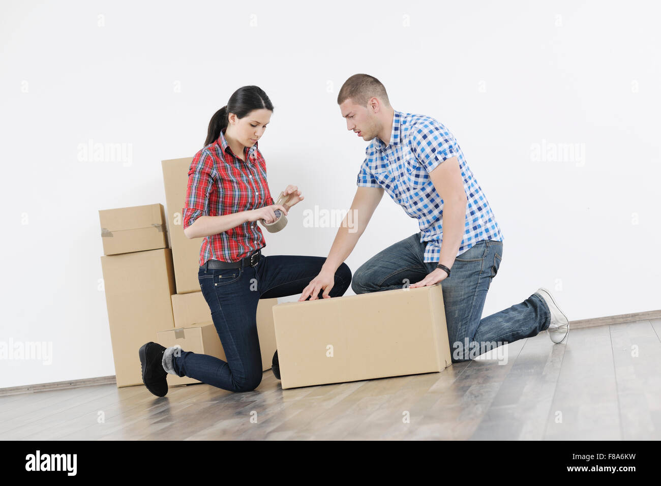 happy Young couple moving in new home Stock Photo - Alamy