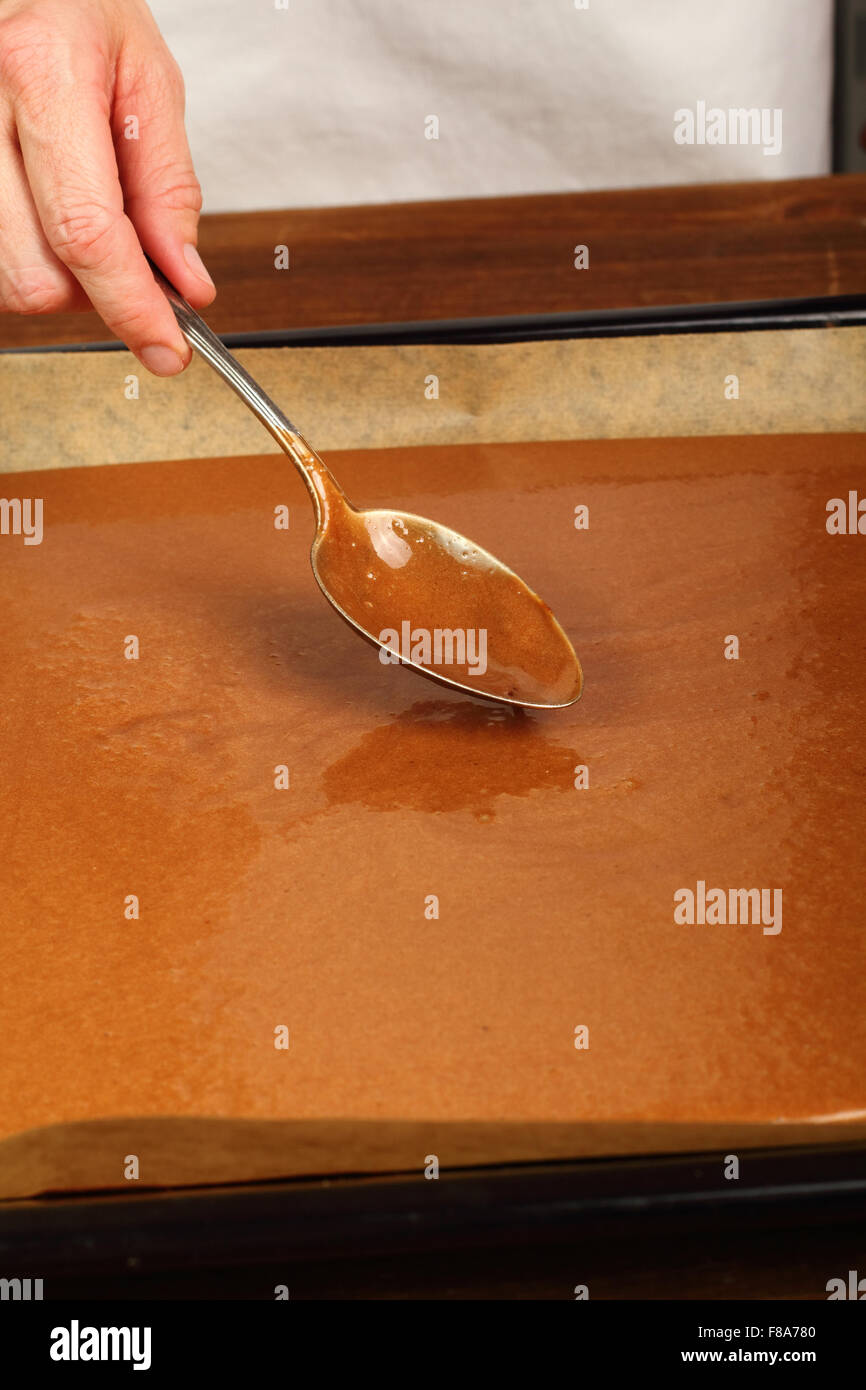 Leveling cake batter on baking sheet. Making Chocolate Brownie. Series