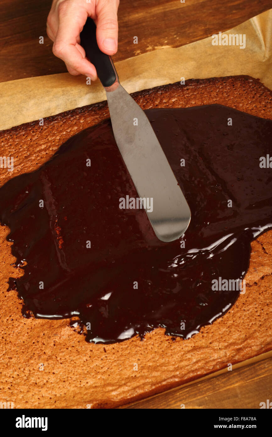 Leveling icing using palette knife. Making Chocolate Brownie. Series