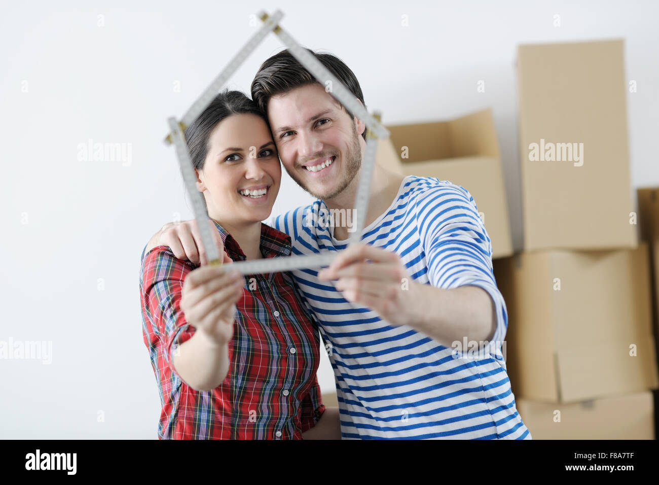 happy Young couple moving in new home Stock Photo - Alamy