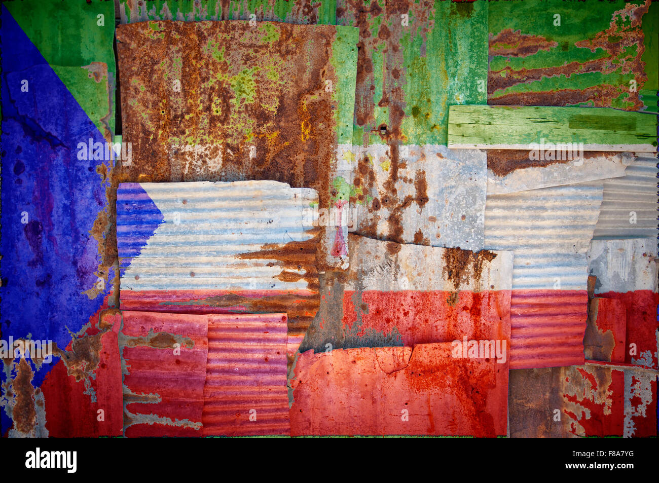 An abstract background image of the flag of Equatorial Guinea painted on to rusty corrugated iron sheets overlapping to form Stock Photo