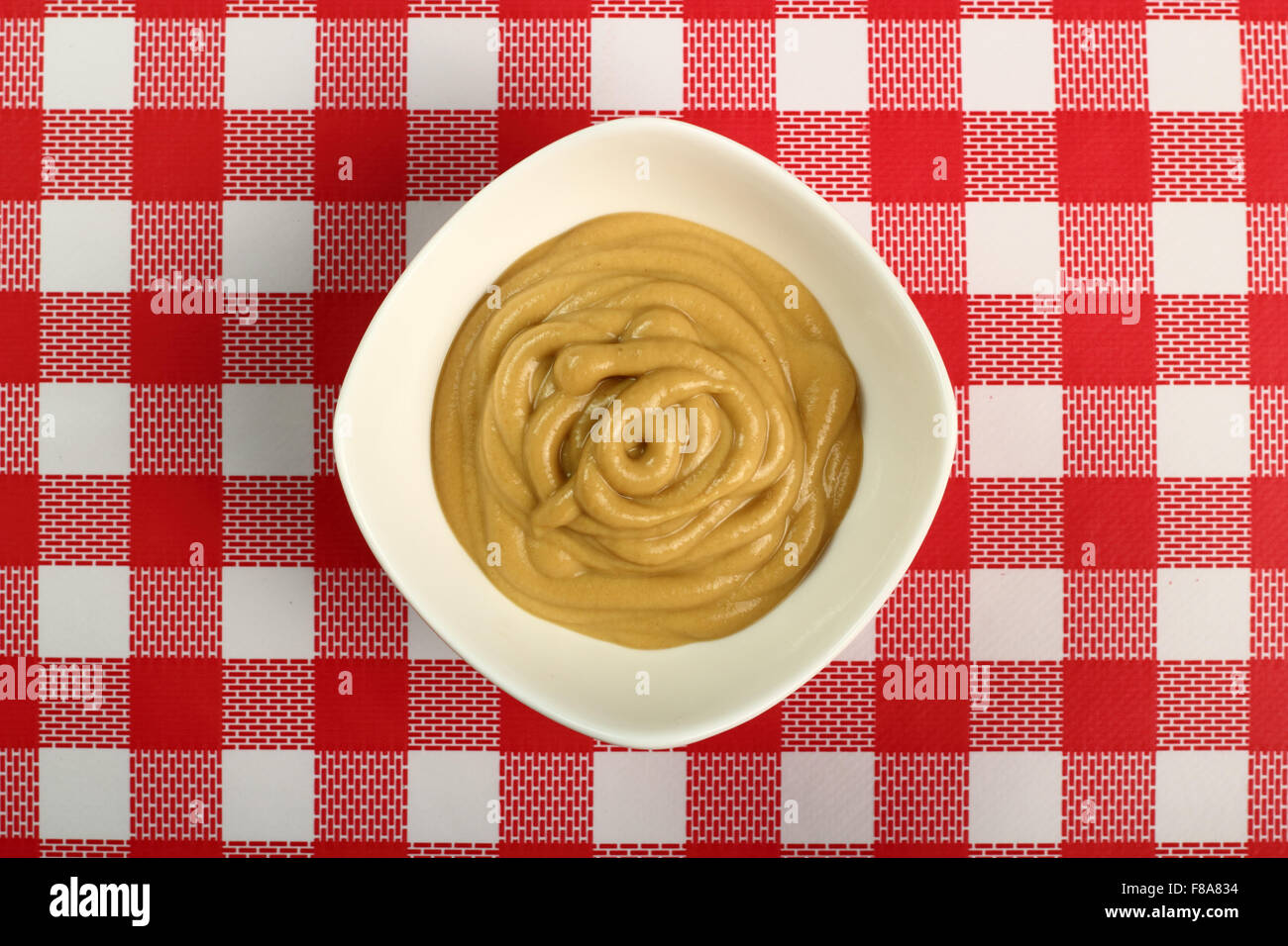 Mustard in bowl. Directly above Stock Photo Alamy