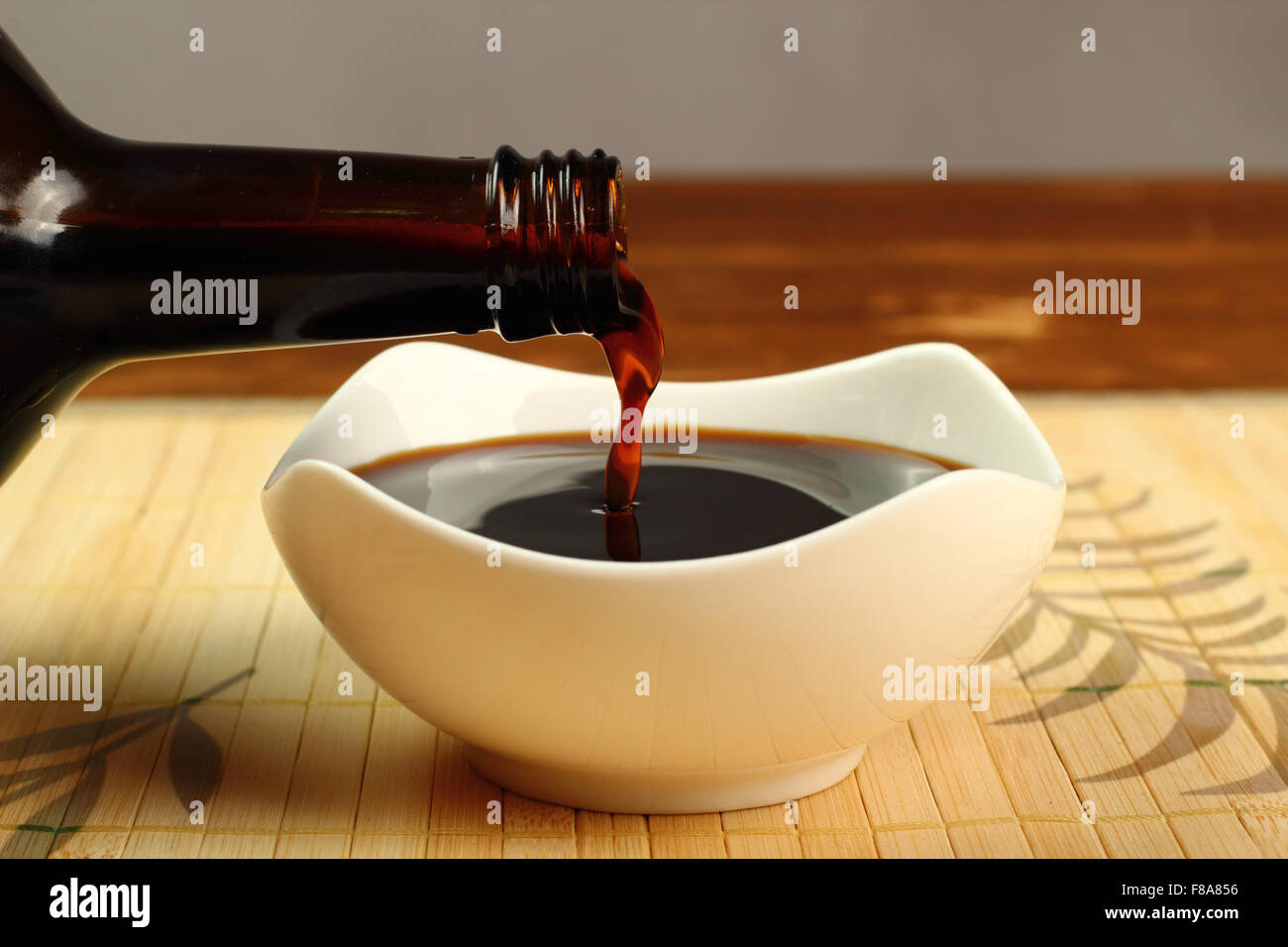 Pouring Soy Sauce into bowl Stock Photo Alamy