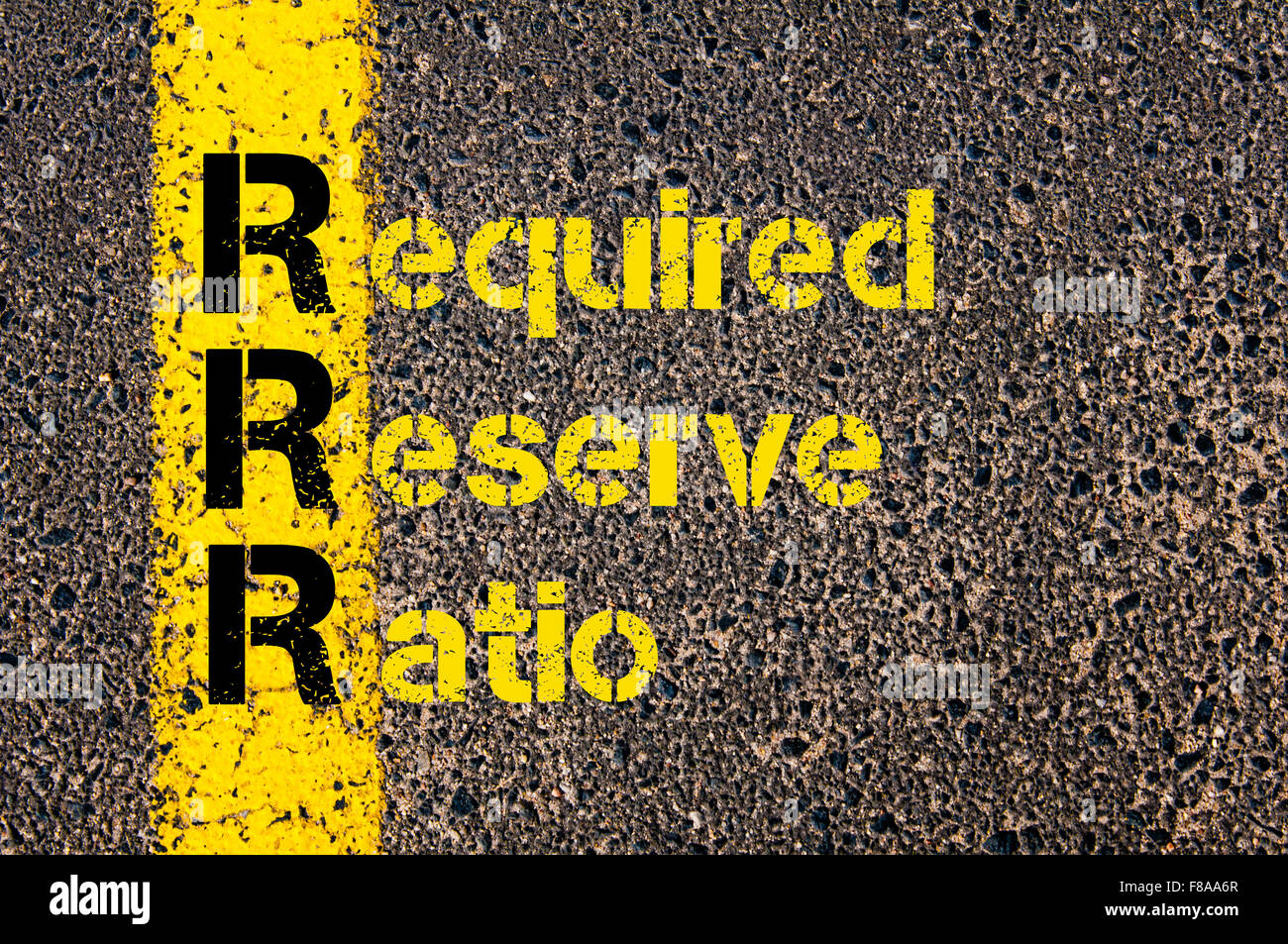 Concept image of Accounting Business Acronym RRR Required Reserve Ratio written over road marking yellow paint line. Stock Photo