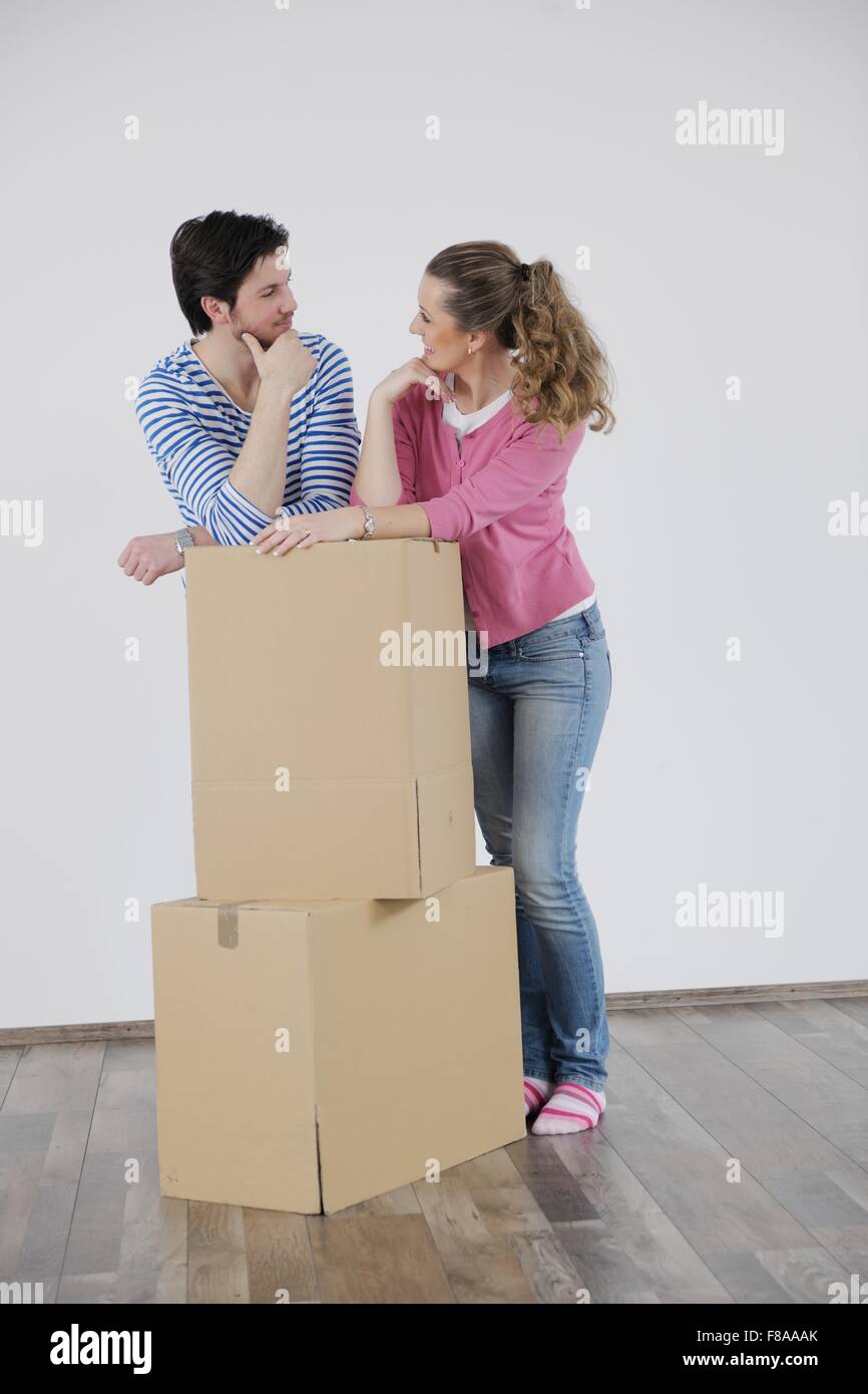 happy Young couple moving in new house Stock Photo - Alamy